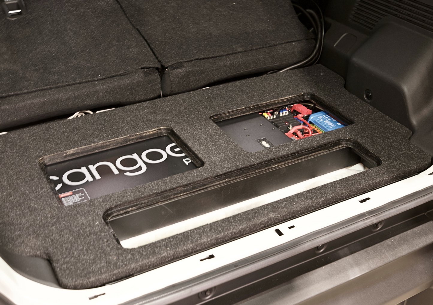 EXPLOREJIMNY jimny xl storage system installed in vehicle trunk with cutouts for battery and components