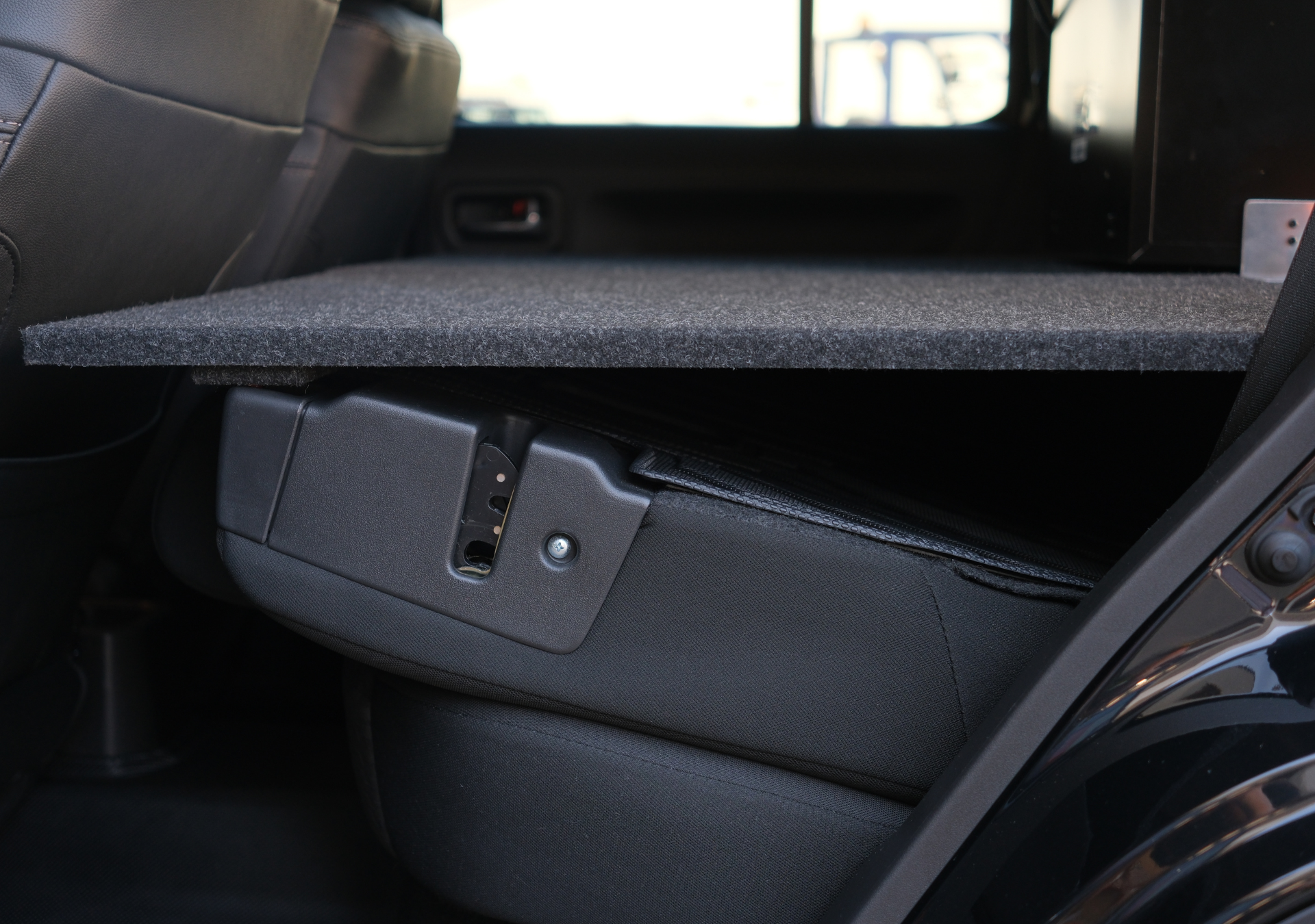 Suzuki Jimny false floor platform installed over rear seats for extra cargo space by EXPLOREJIMNY