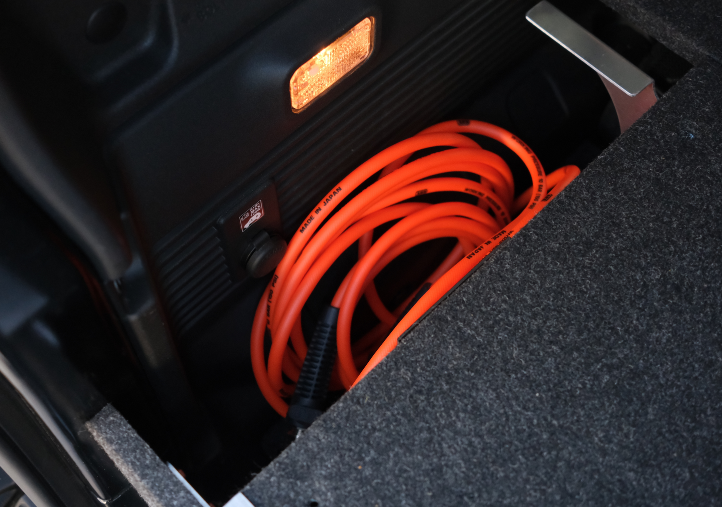 Suzuki Jimny XL Drawer System and Wing Kit rear drawer showing coiled orange extension cable and interior light