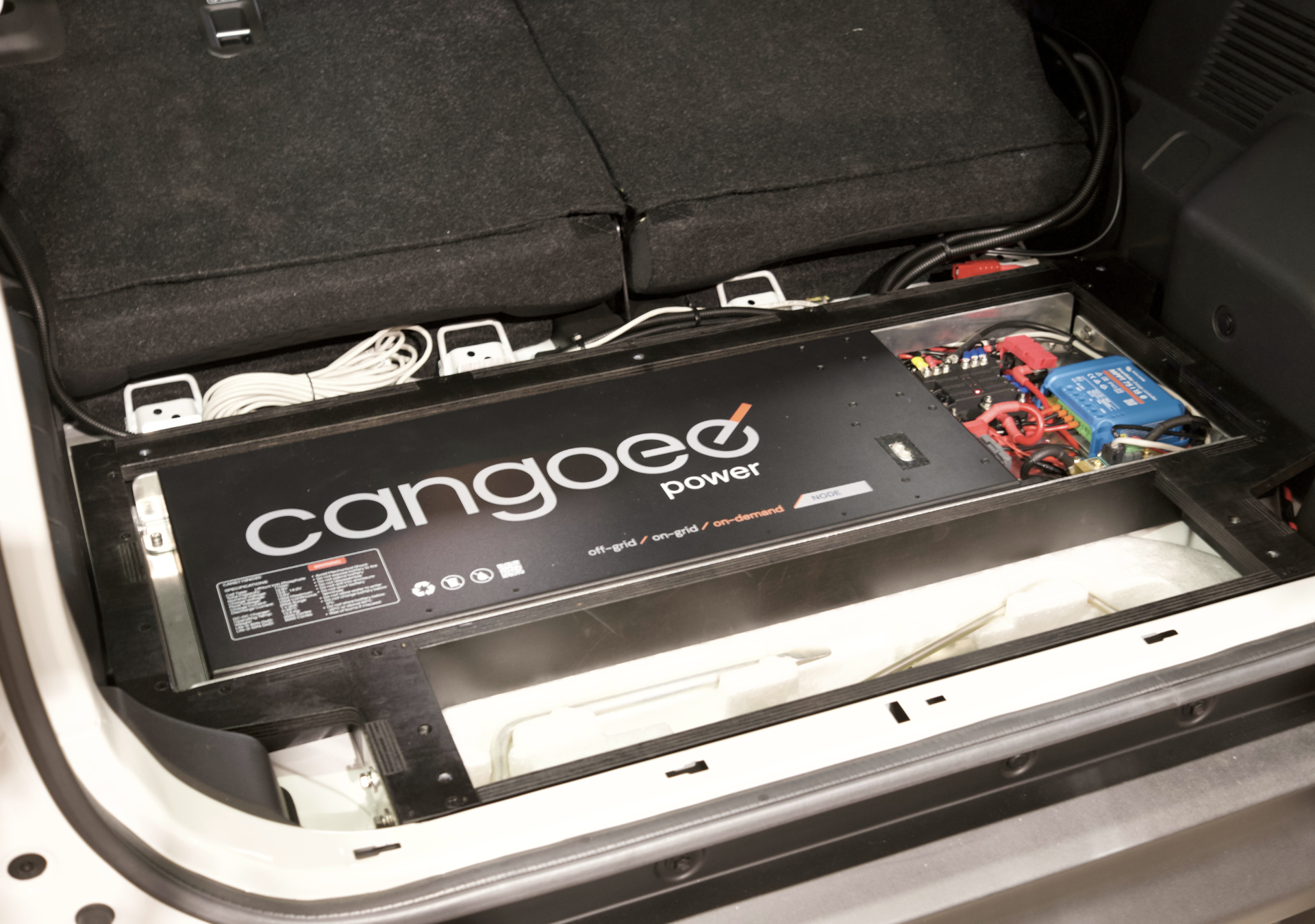 Jimny XL storage system by EXPLOREJIMNY installed in vehicle trunk with organized power unit and cables