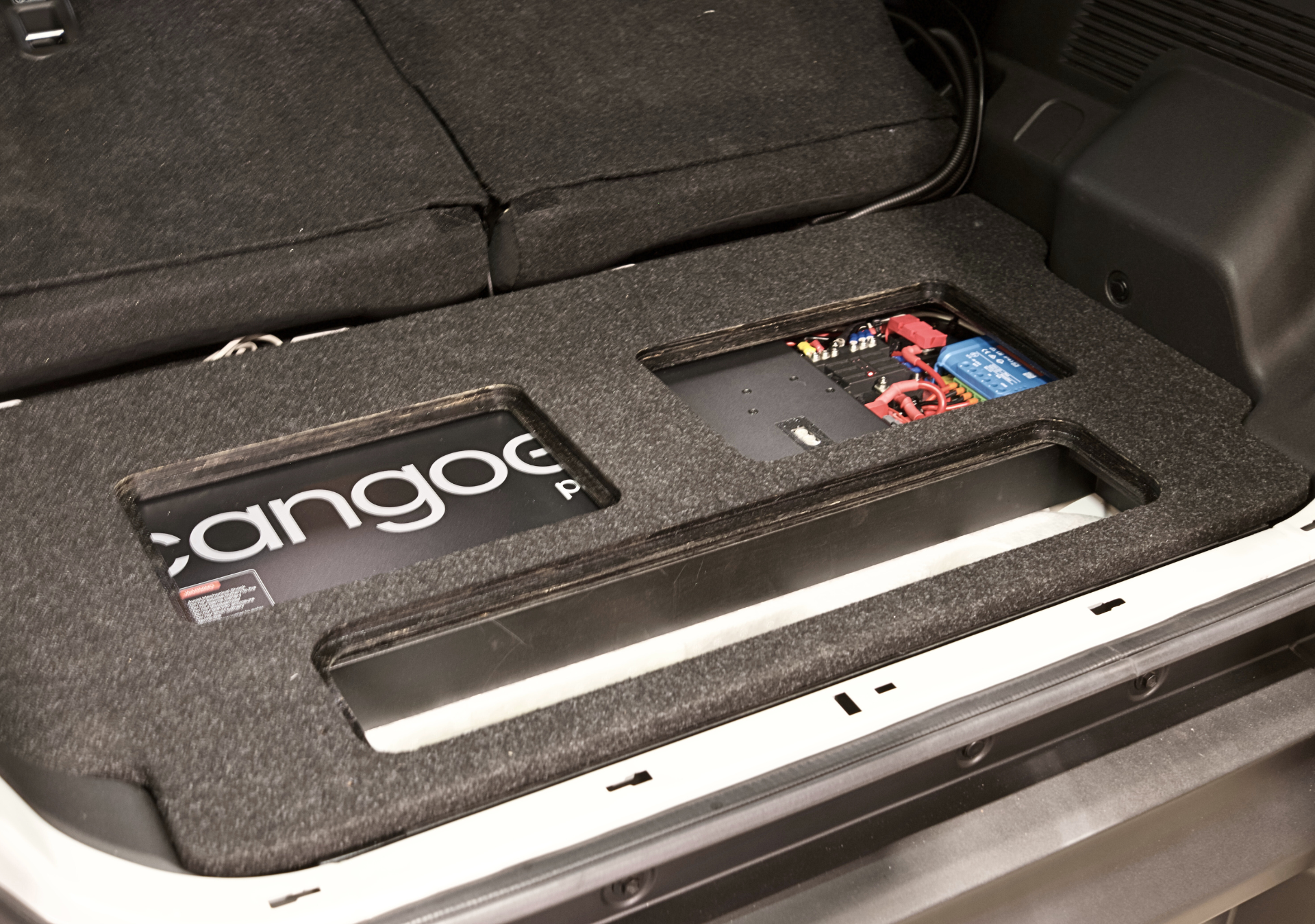 EXPLOREJIMNY jimny xl storage system installed in vehicle trunk with cutouts for battery and components