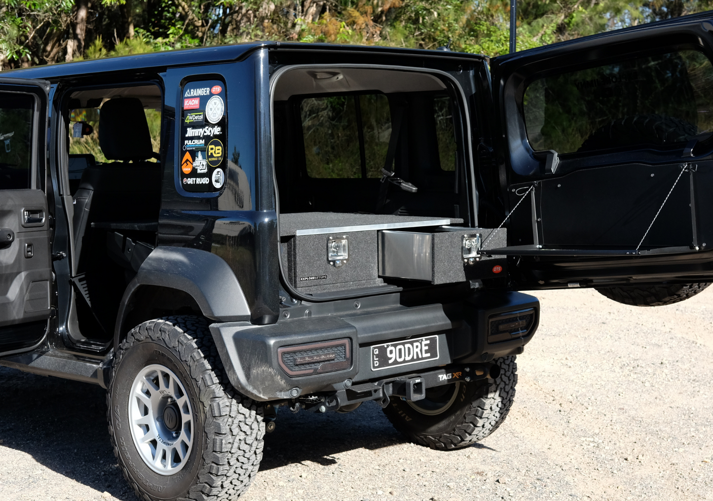 Suzuki Jimny XL Drawer System and Wing Kit installed in black Jimny showing open rear drawer and wing door